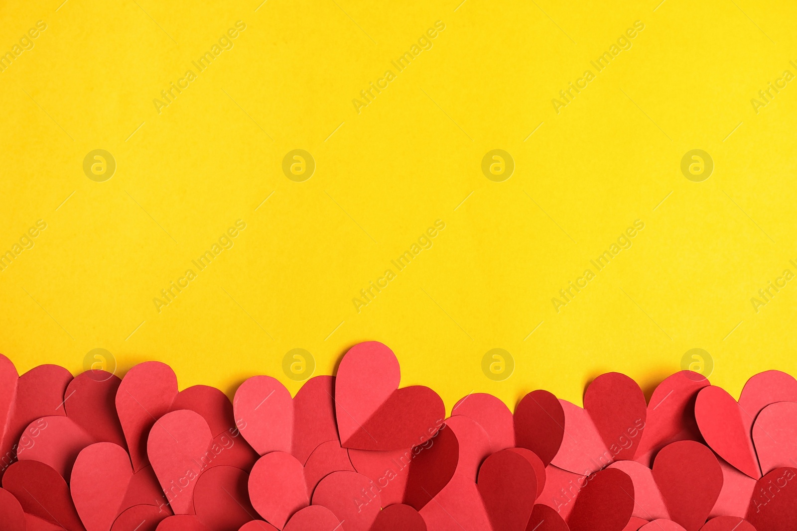 Photo of Flat lay composition with paper hearts and space for text on color background