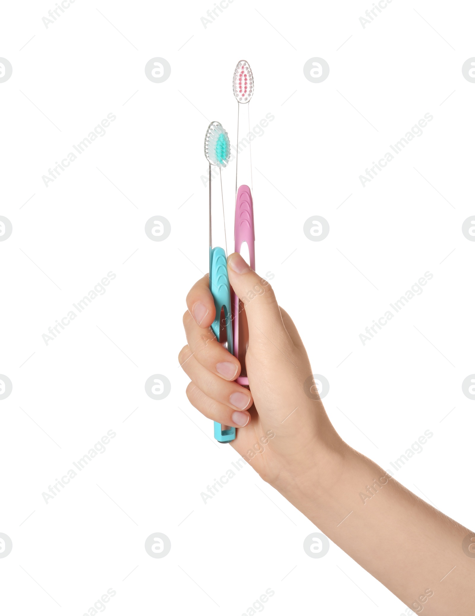 Photo of Woman holding manual toothbrushes against white background