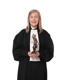 Smiling senior judge with figure of Lady Justice on white background