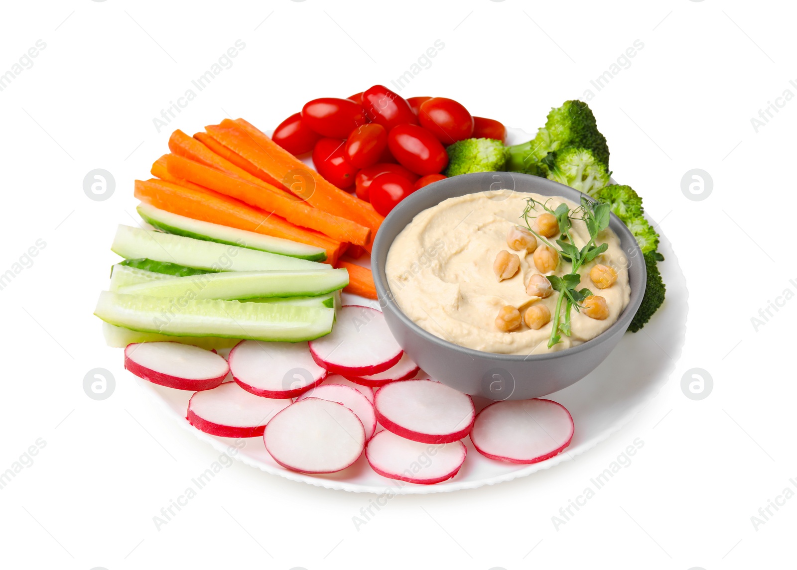 Photo of Plate with delicious hummus and fresh vegetables on white background