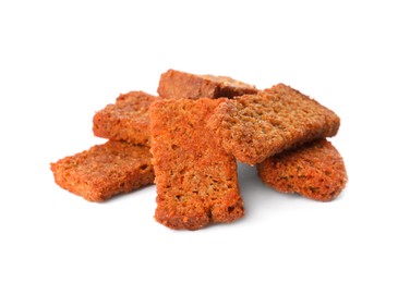 Photo of Heap of crispy rusks with seasoning on white background