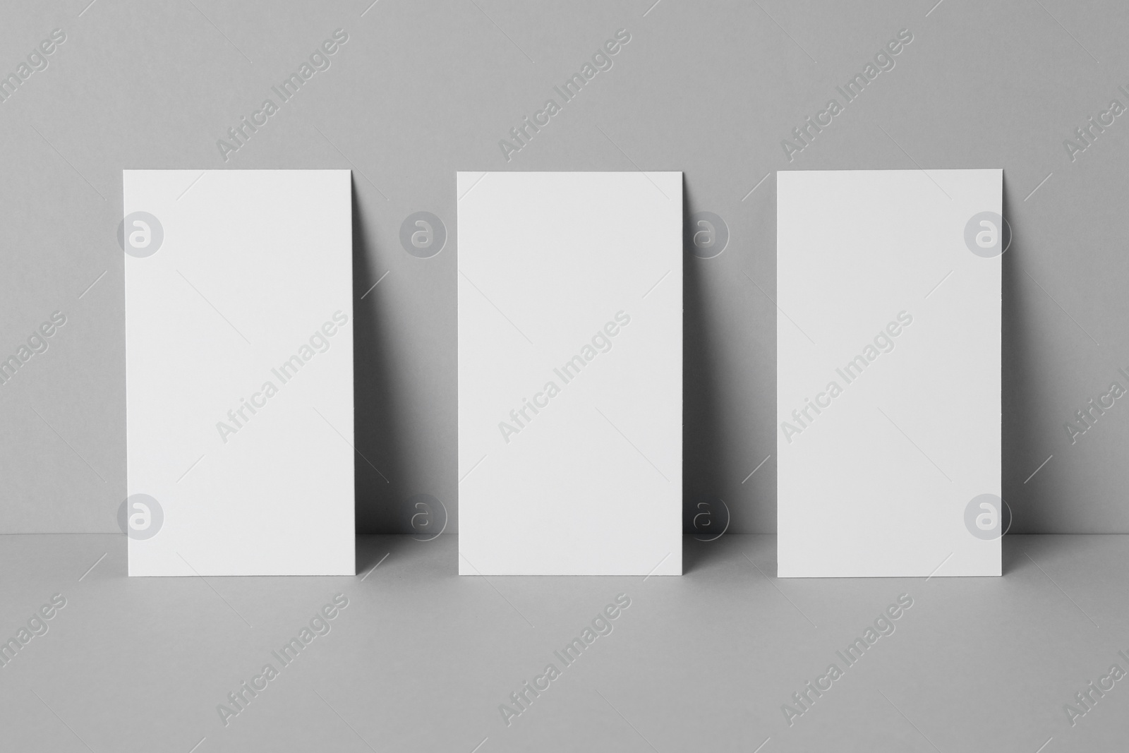 Photo of Blank business cards on light gray background. Mockup for design