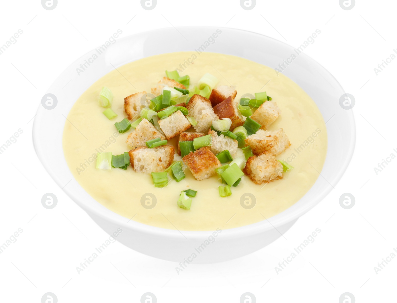 Photo of Tasty potato soup with croutons and green onion in bowl isolated on white