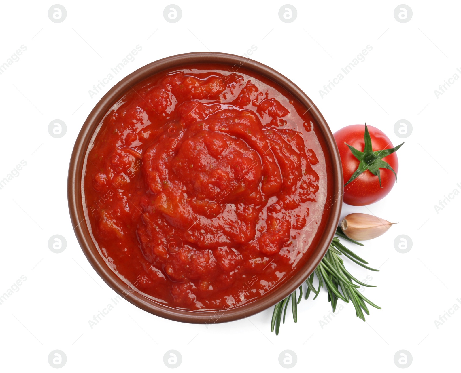 Photo of Homemade tomato sauce in bowl and fresh ingredients isolated on white, top view