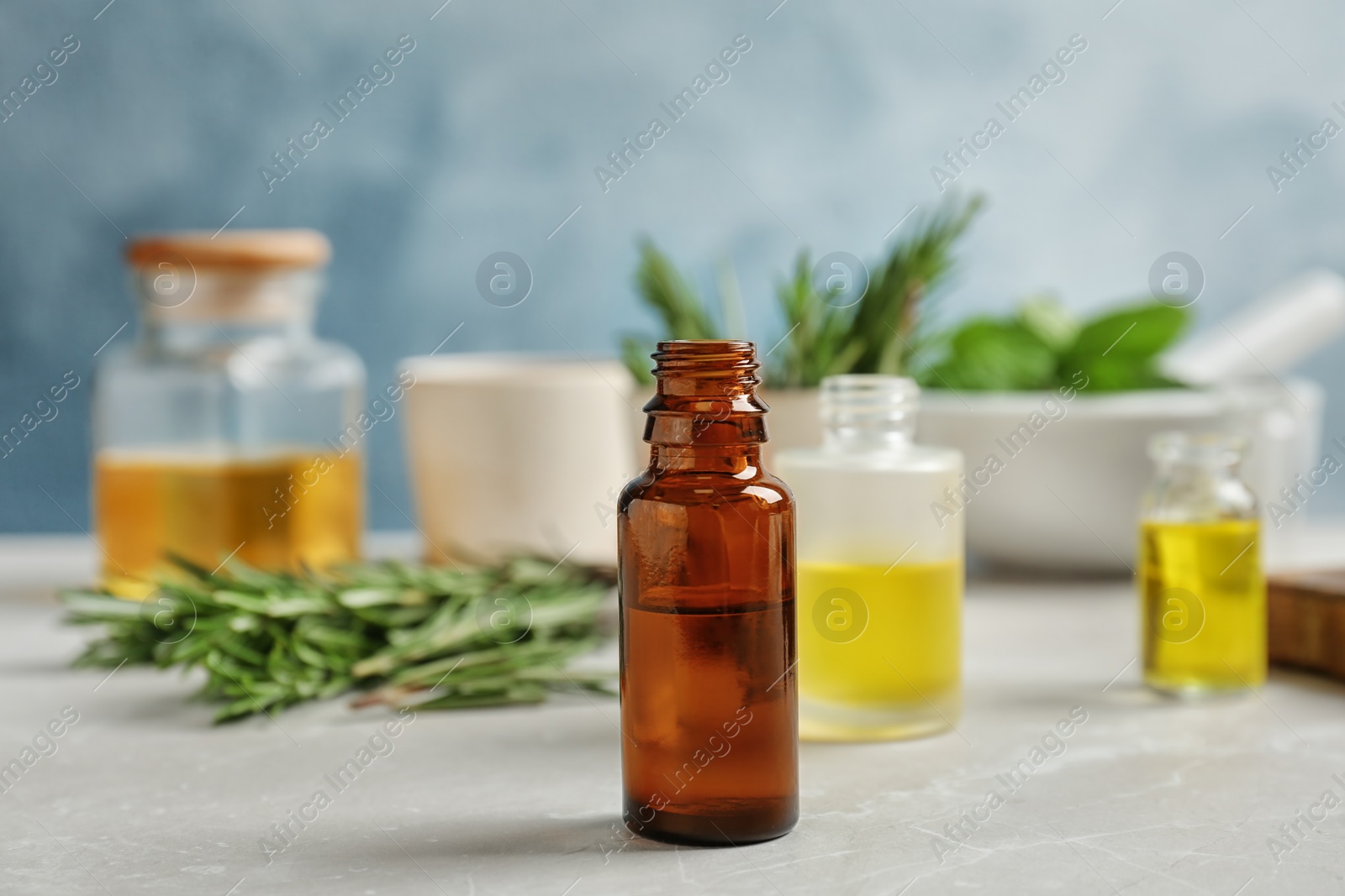 Photo of Bottle with essential oil on table