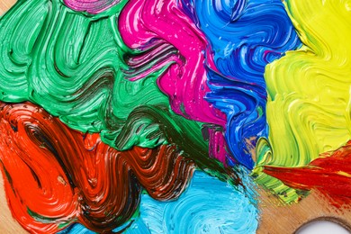 Photo of Abstract colorful acrylic paint as background, top view