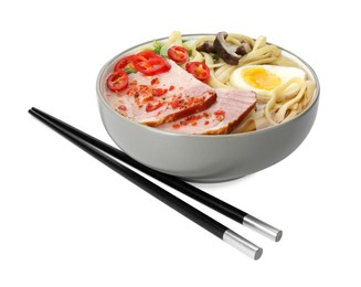 Photo of Delicious ramen in bowl and chopsticks isolated on white. Noodle soup