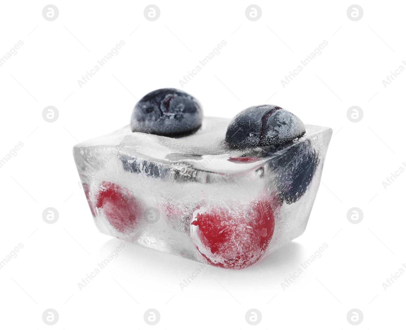 Photo of Raw berries frozen in ice cube on white background