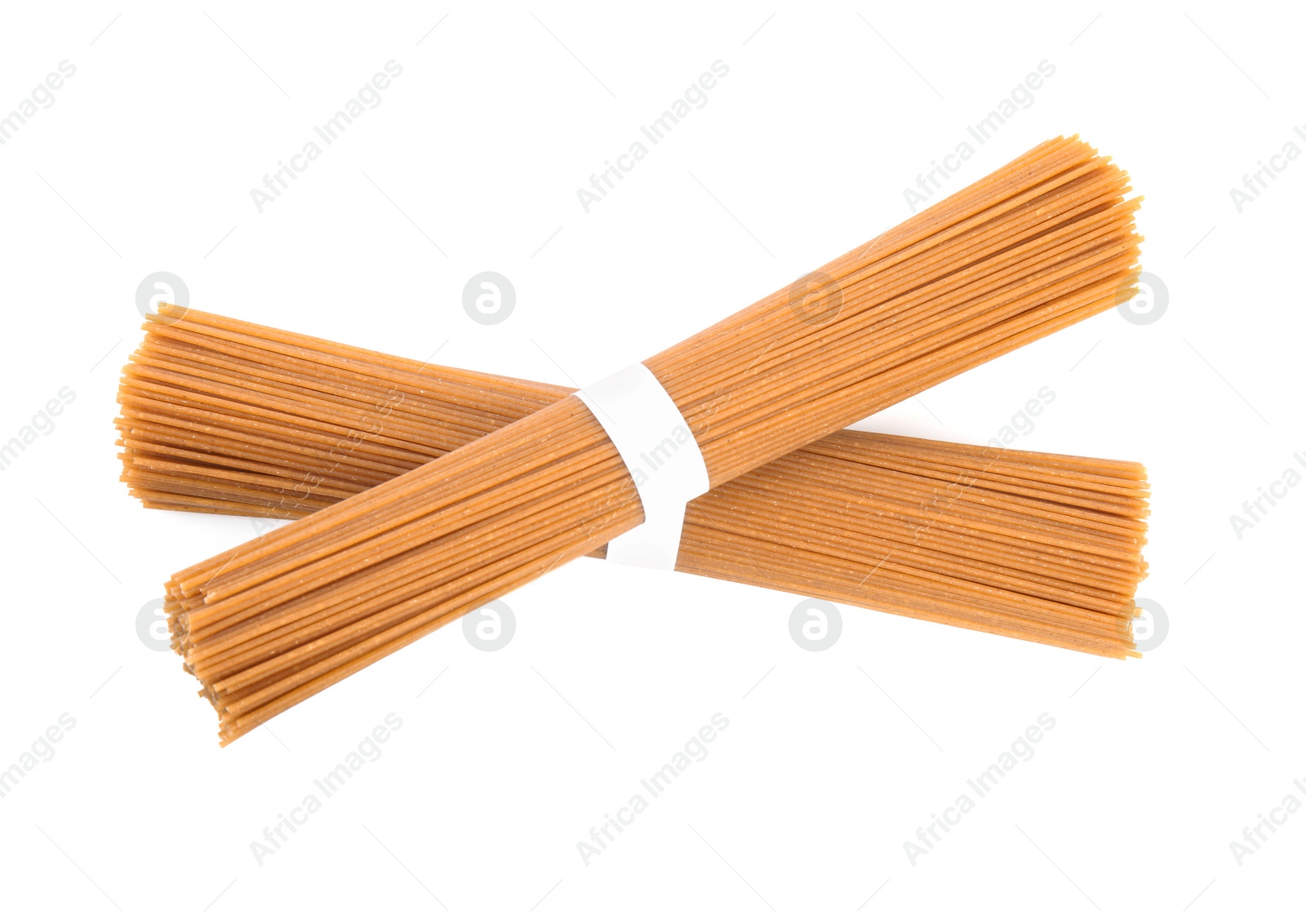 Photo of Uncooked buckwheat noodles isolated on white. Japanese cuisine