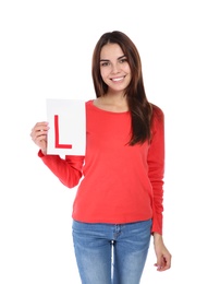 Photo of Young woman with L-plate on white background. Getting driving license
