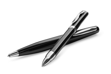 New stylish black pens isolated on white, closeup