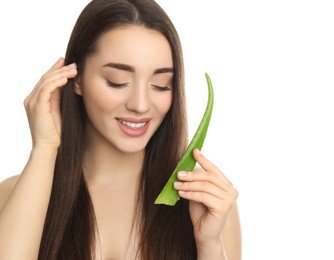 Photo of Young woman with aloe vera leaf on white background