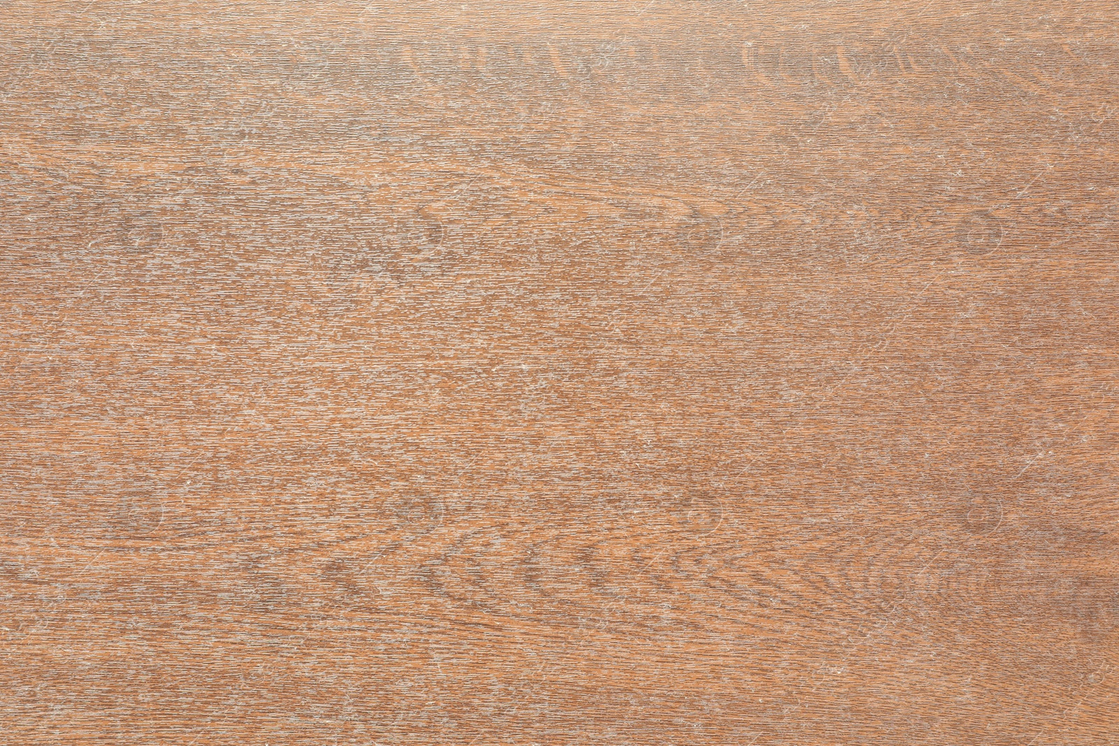 Photo of Texture of brown wooden surface as background