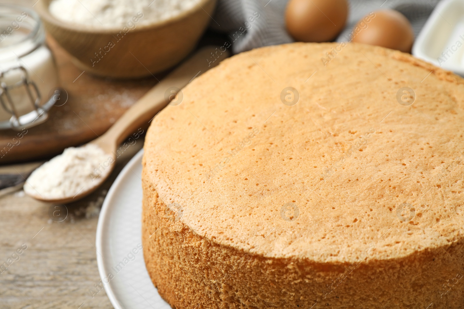 Photo of Delicious fresh homemade cake on wooden table, closeup