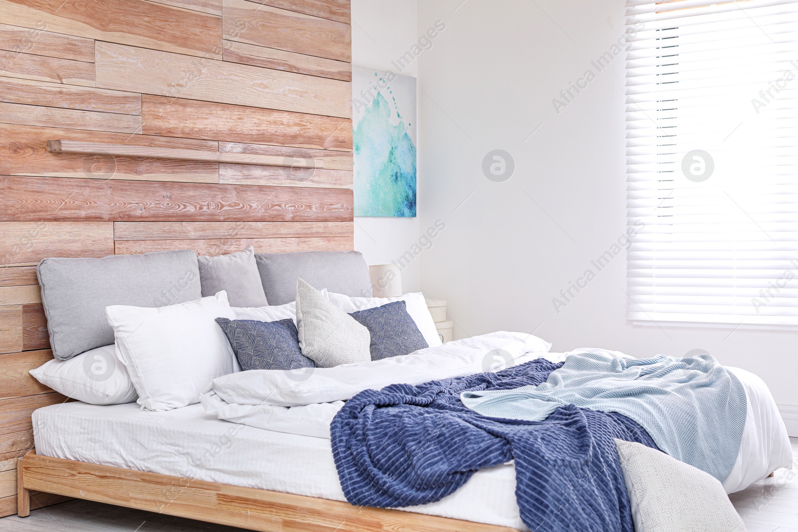 Photo of Stylish room interior with big comfortable bed