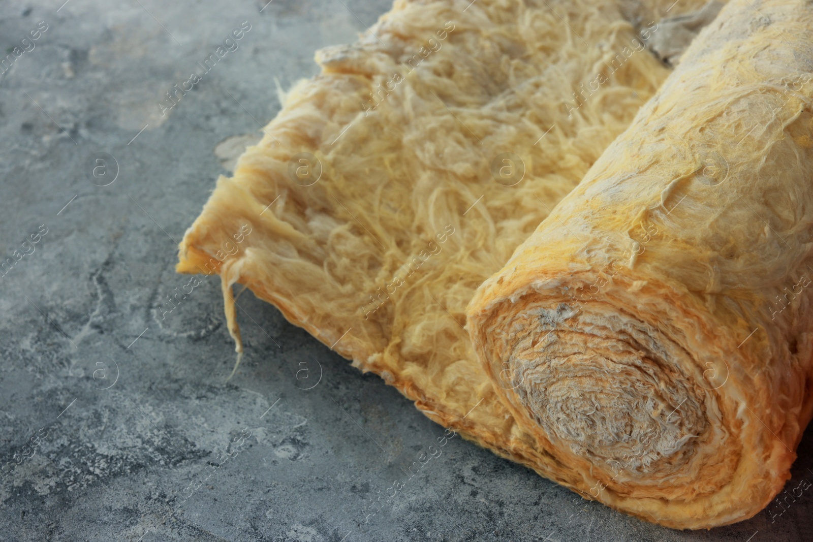 Photo of Thermal insulation material on concrete floor, closeup