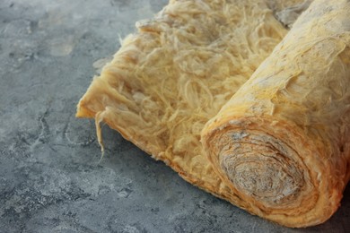 Photo of Thermal insulation material on concrete floor, closeup