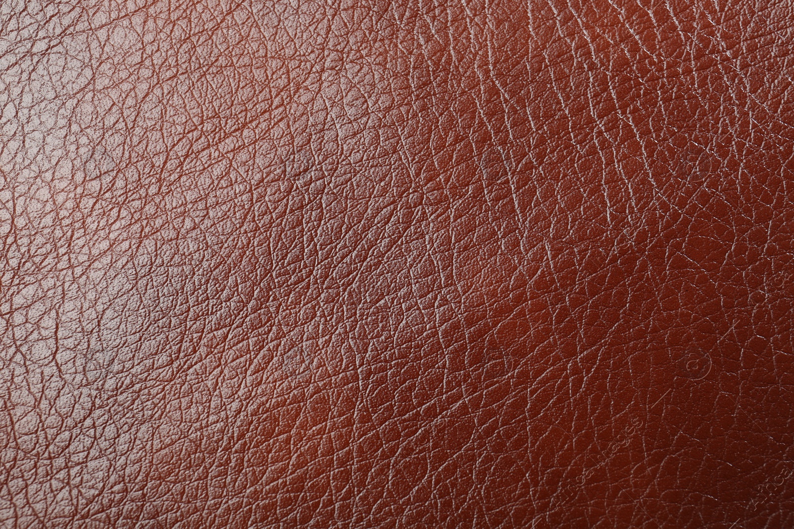 Photo of Texture of brown leather as background, top view