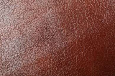 Texture of brown leather as background, top view