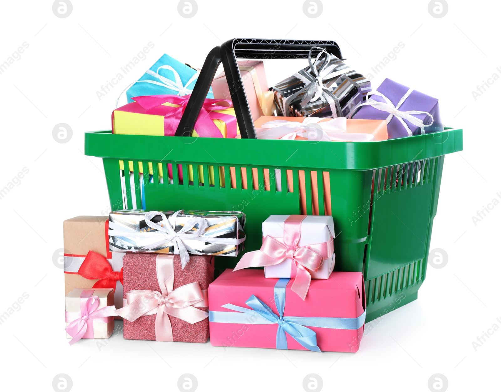 Photo of Green shopping basket with different gifts on white background