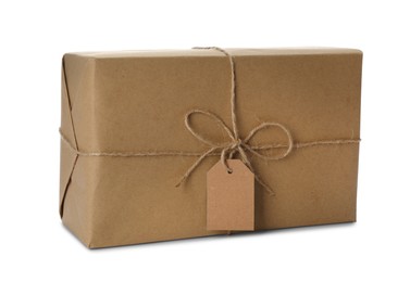 Photo of Parcel wrapped in kraft paper with empty label on white background