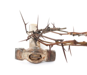 Photo of Crown of thorns and hammer on white background. Easter attributes