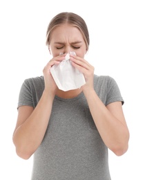 Young woman suffering from allergy on white background