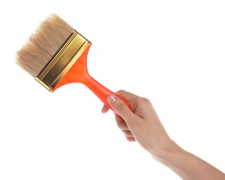 Photo of Woman holding paint brush on white background, closeup