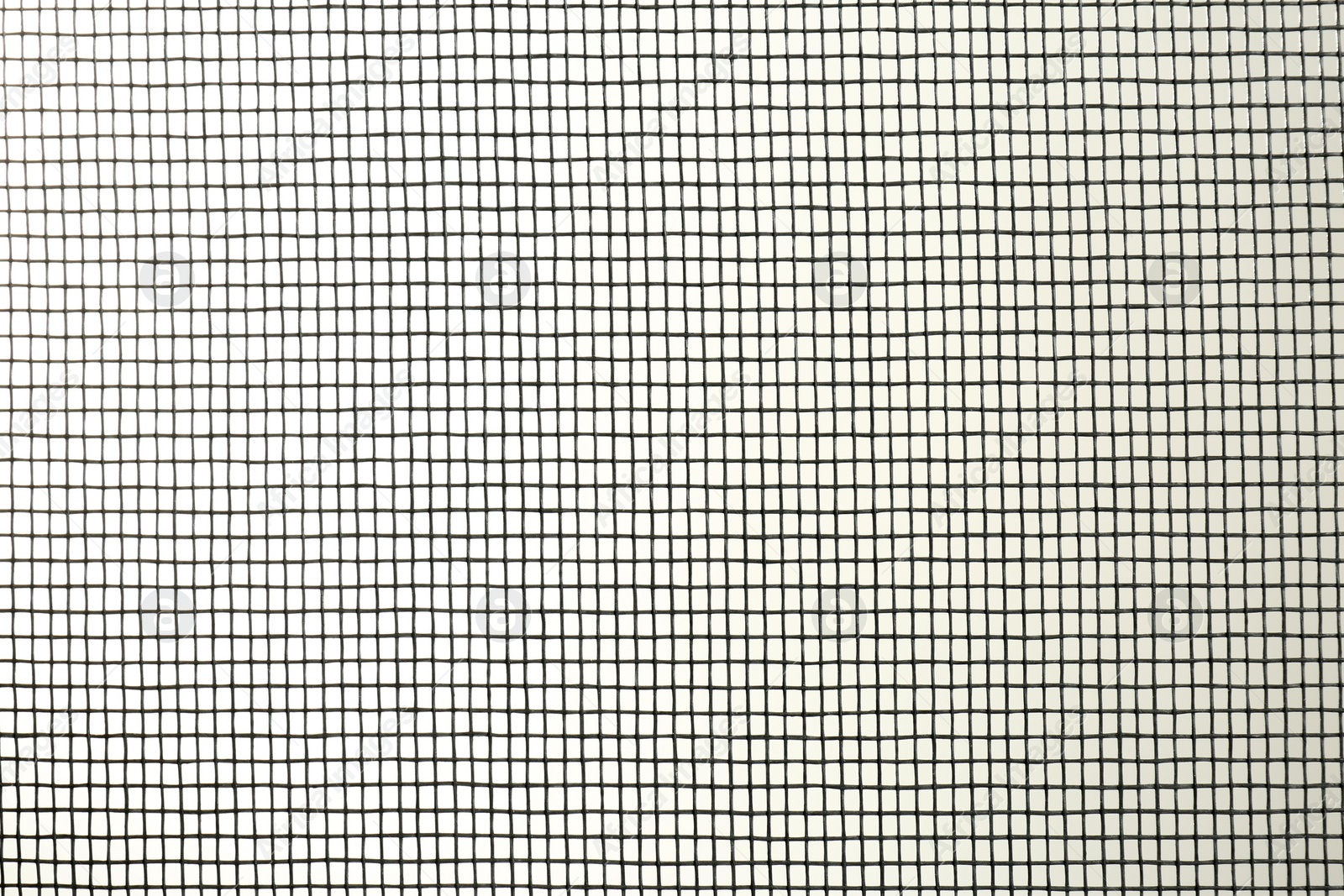 Photo of Closeup view of mosquito window screen on white background