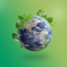 Image of Recycling concept. Earth planet with green leaves on color background