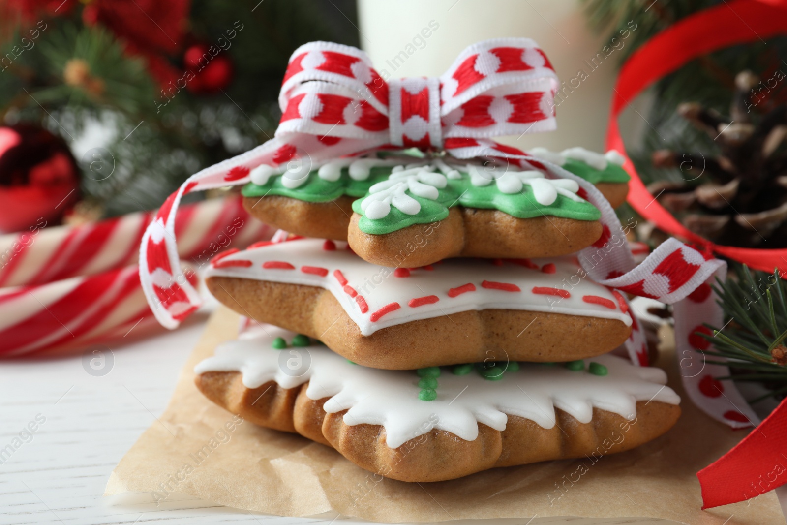 Photo of Delicious Christmas cookies on white wooden table, closeup