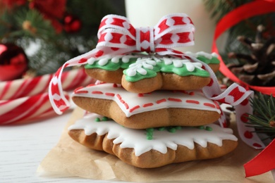 Photo of Delicious Christmas cookies on white wooden table, closeup