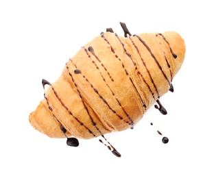 Tasty croissant with chocolate sauce on white background