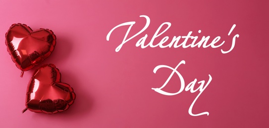 Image of Happy Valentine's Day. Red heart shaped balloons on pink background, flat lay