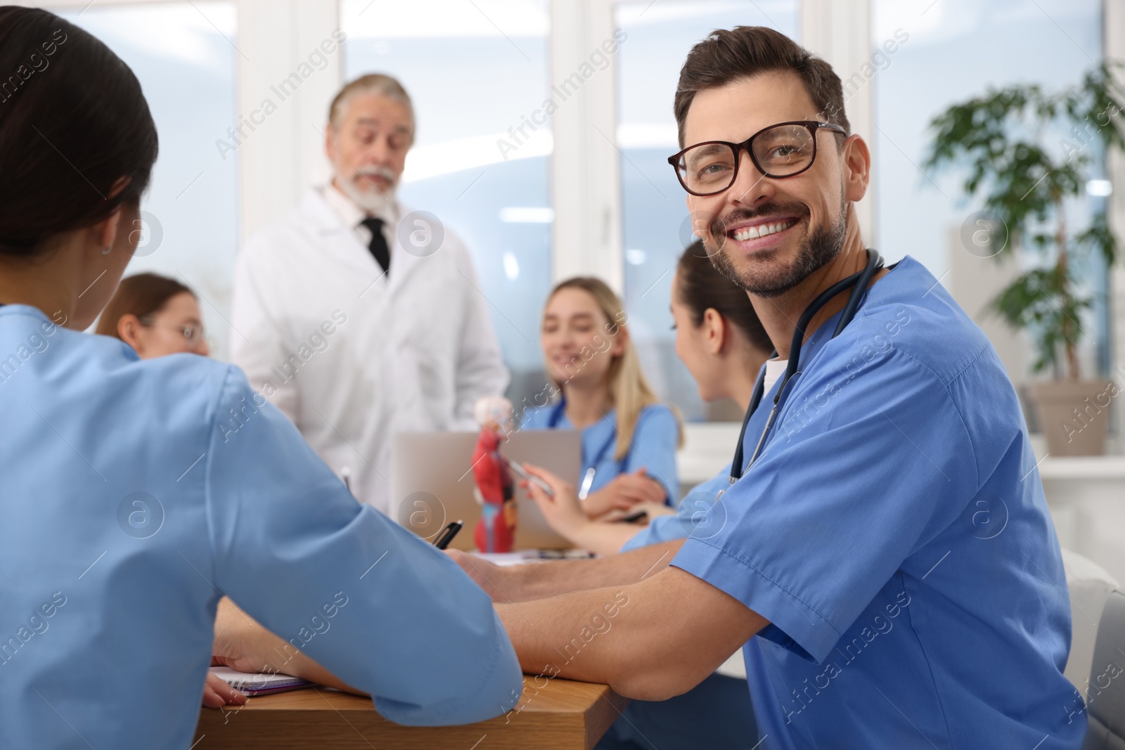 Photo of Portrait of young intern wearing uniform on lecture in university