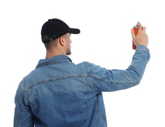 Photo of Man holding spray paint against white background, back view