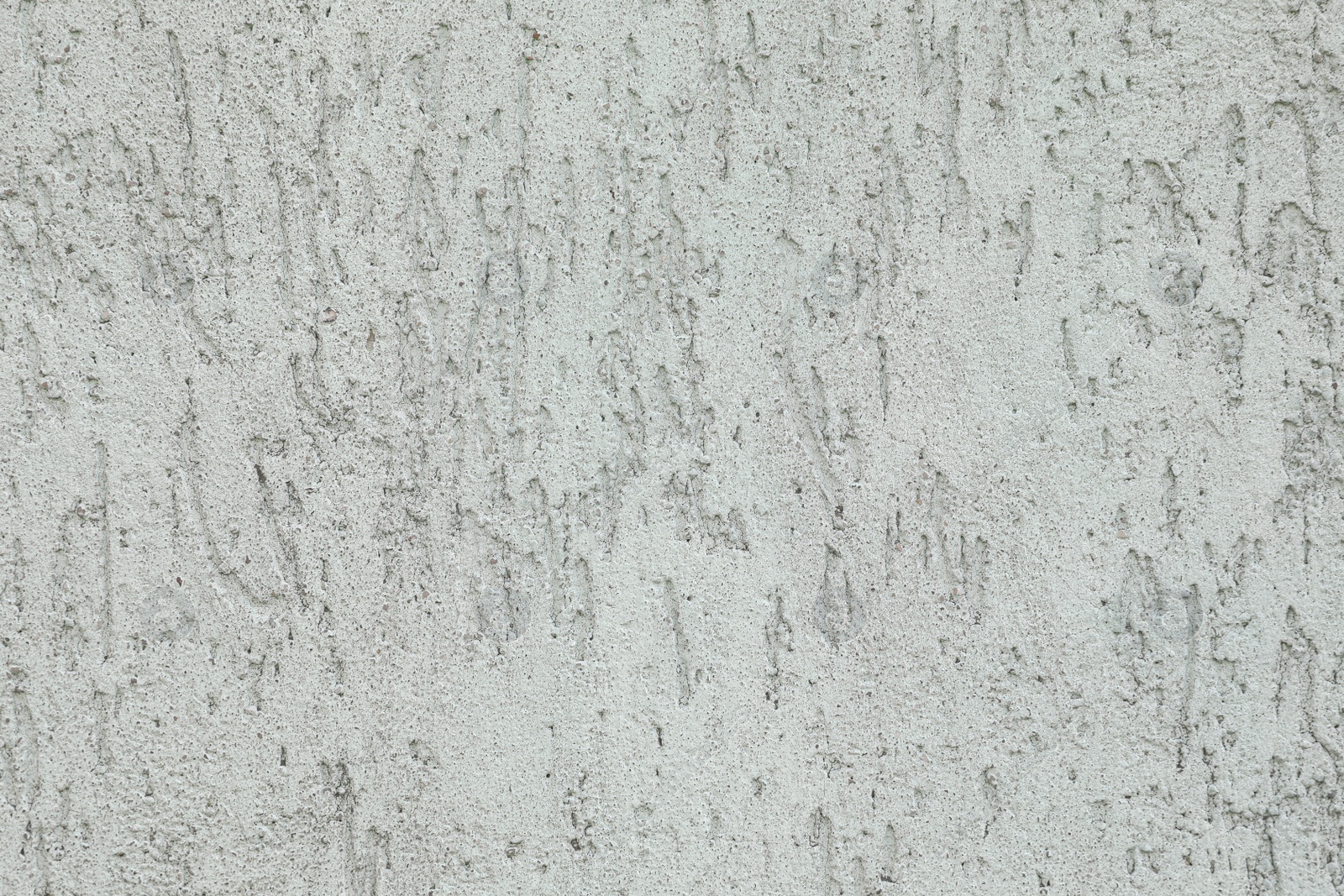 Photo of Texture of light plaster wall as background