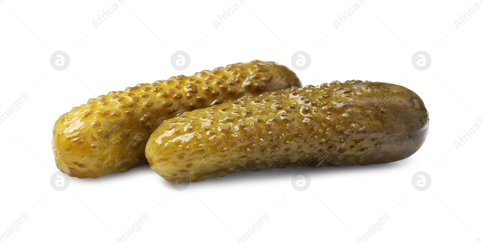 Photo of Two tasty pickled cucumbers isolated on white