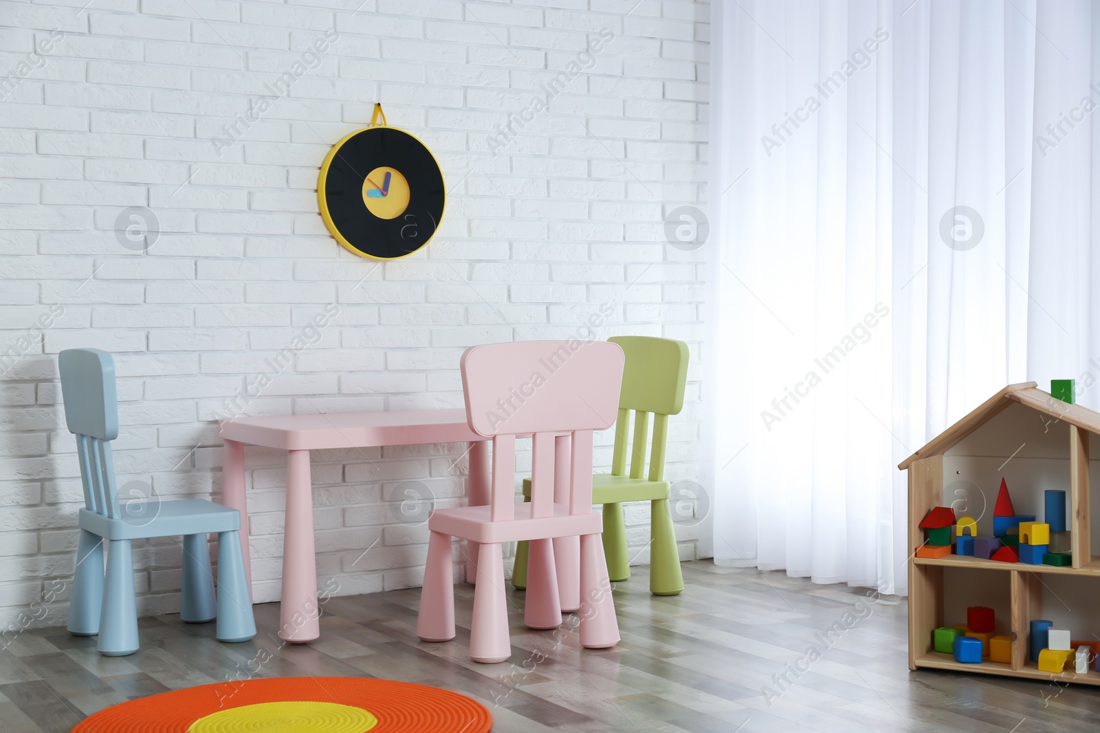 Photo of Modern child room interior with table and chairs