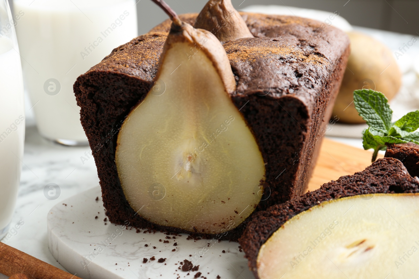 Photo of Tasty pear bread on table, closeup. Homemade cake