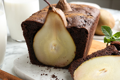 Photo of Tasty pear bread on table, closeup. Homemade cake