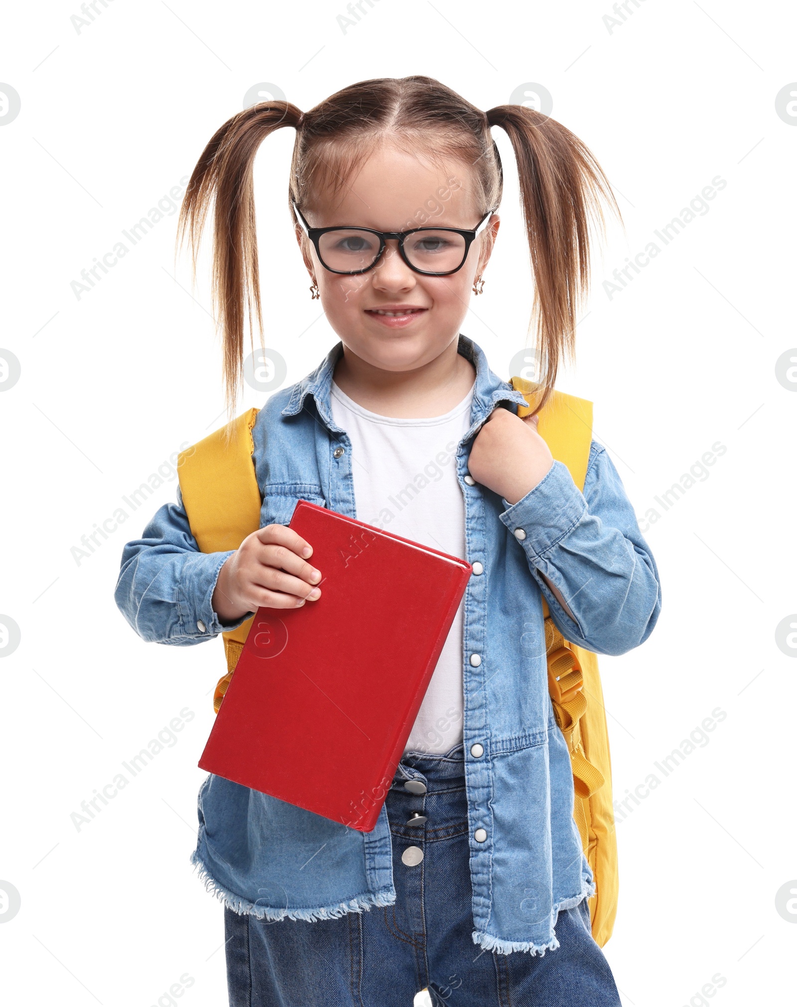 Photo of Cute little girl in glasses with book and backpack on white background