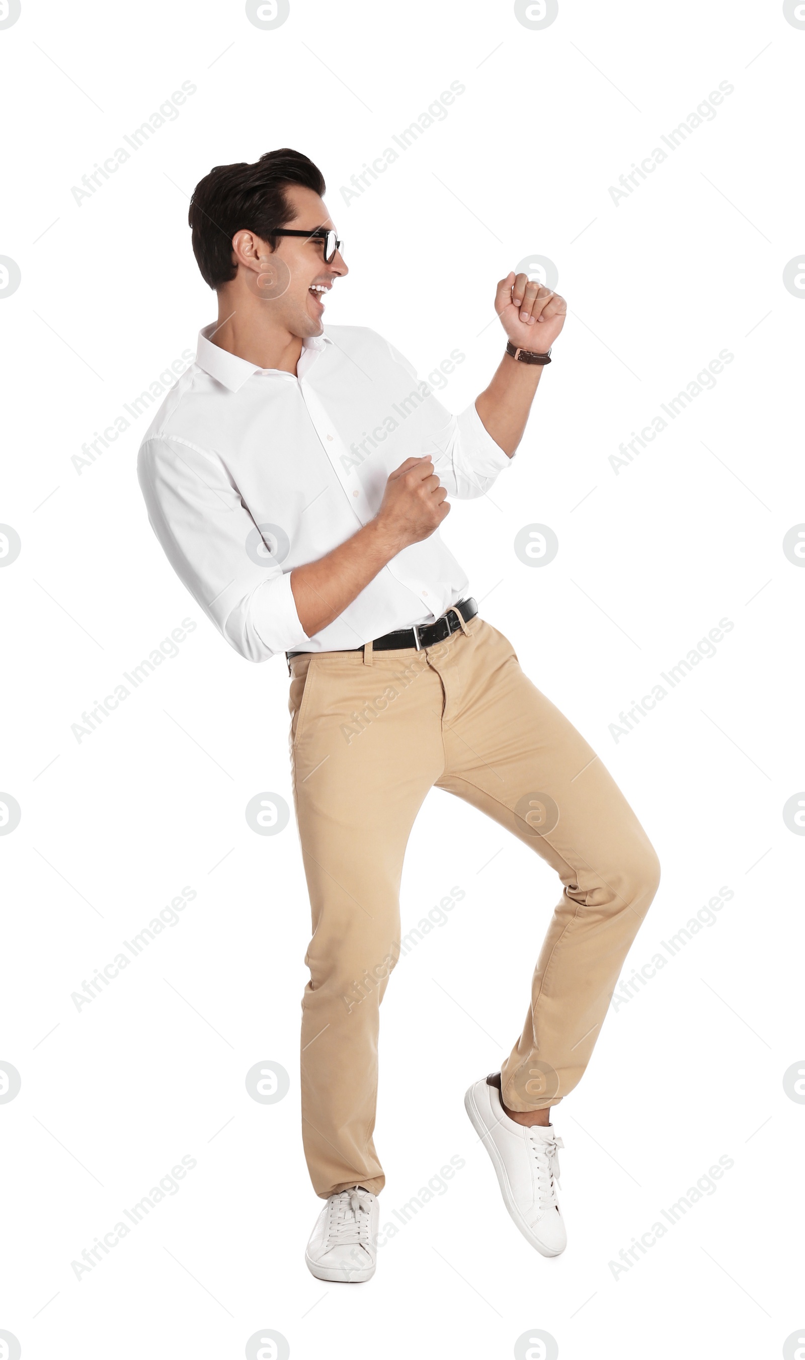 Photo of Handsome young man with glasses dancing on white background