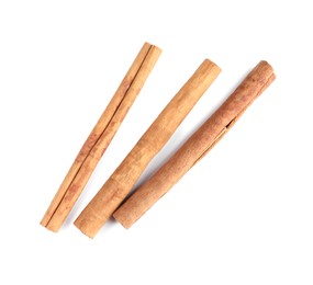 Photo of Cinnamon sticks isolated on white, top view