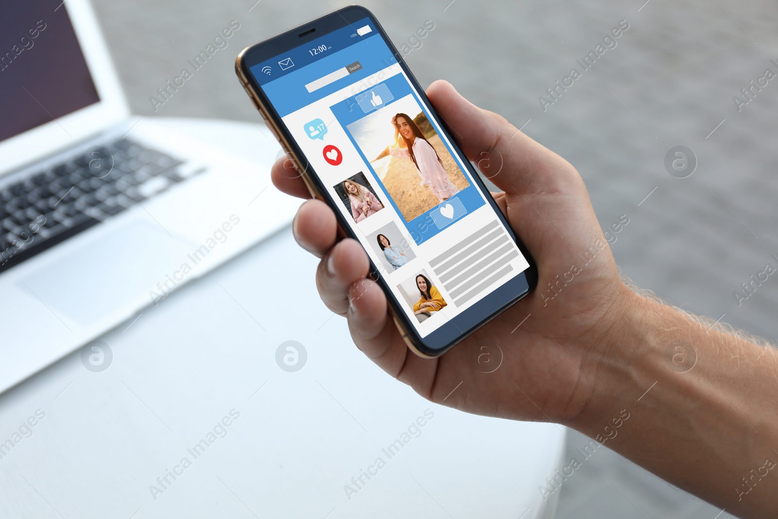 Image of Young man visiting online dating site via smartphone in outdoor cafe, closeup