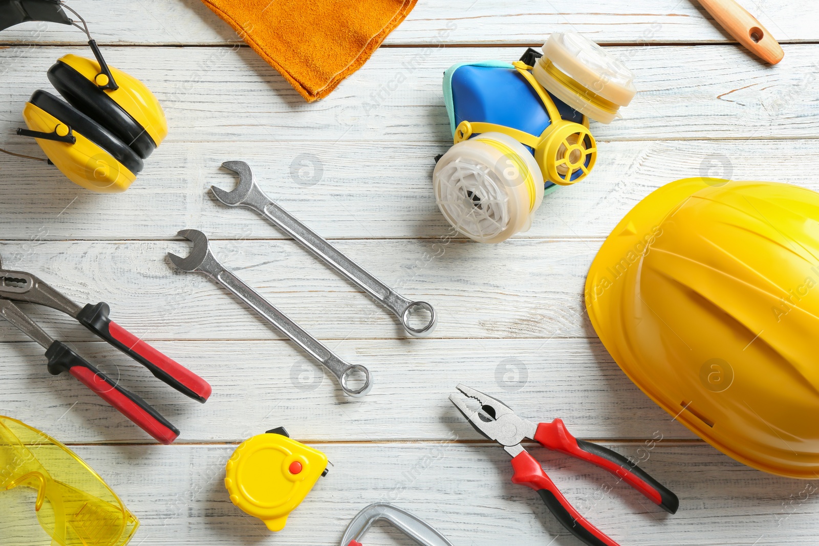 Photo of Flat lay composition with construction tools on wooden background