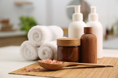 Photo of Composition with spa products on white table in bathroom, closeup