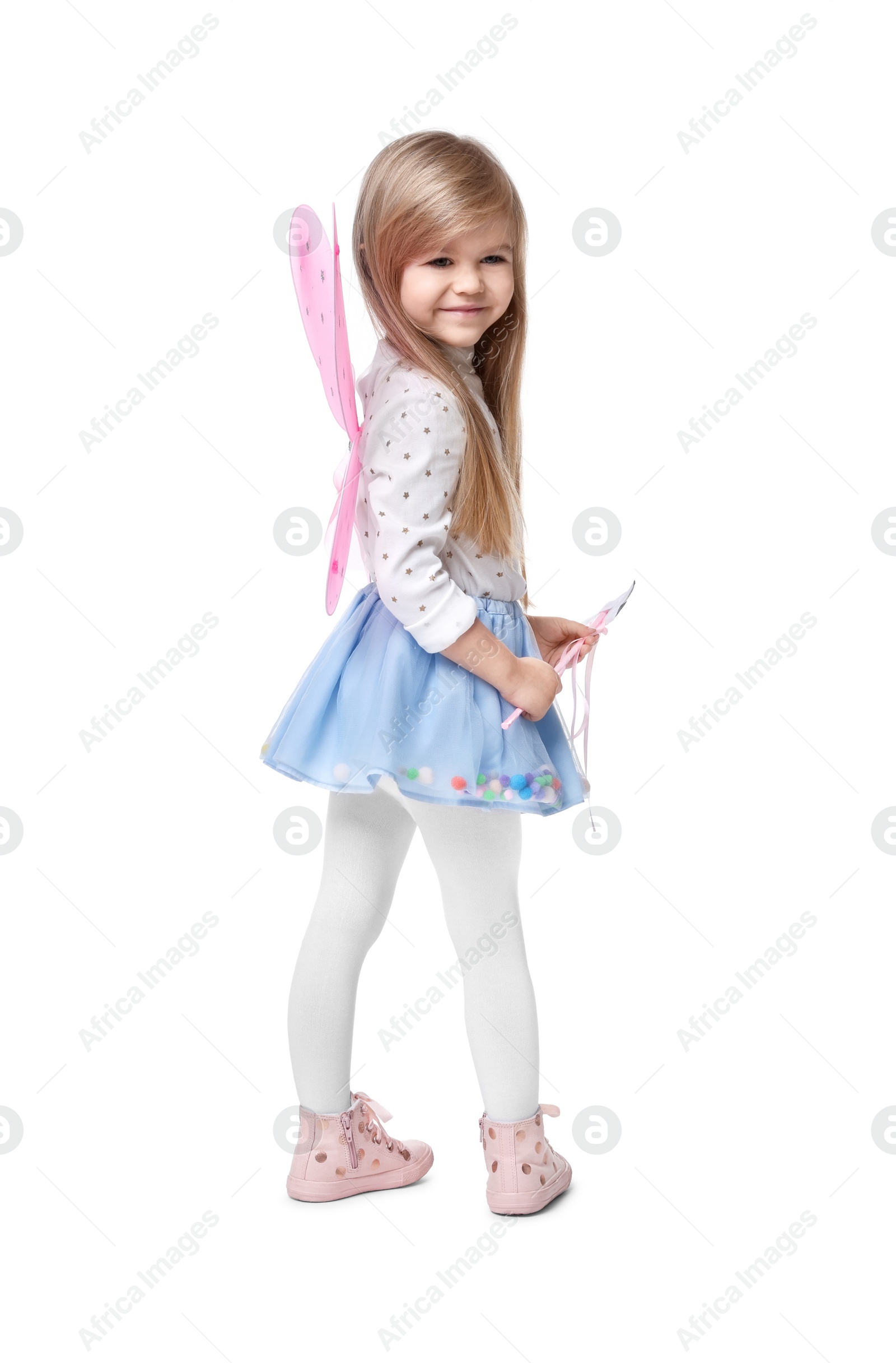 Photo of Cute little girl in fairy costume with pink wings and magic wand on white background