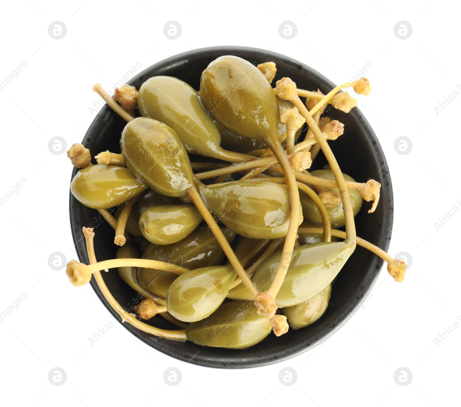 Photo of Capers in bowl isolated on white, top view