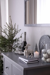 Photo of Beautiful room interior decorated for Christmas with potted fir